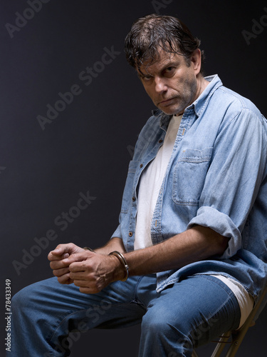 Photos Man, mature, with handcuffs on