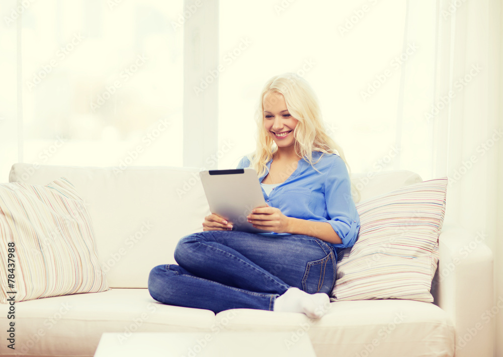 smiling woman with tablet pc computer at home smiling woman with tablet pc computer at home