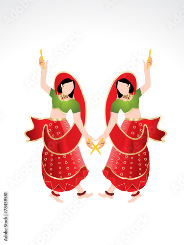 Traditional indian girl playing dandiya