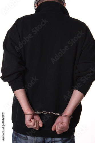 Arrested man handcuffed hands