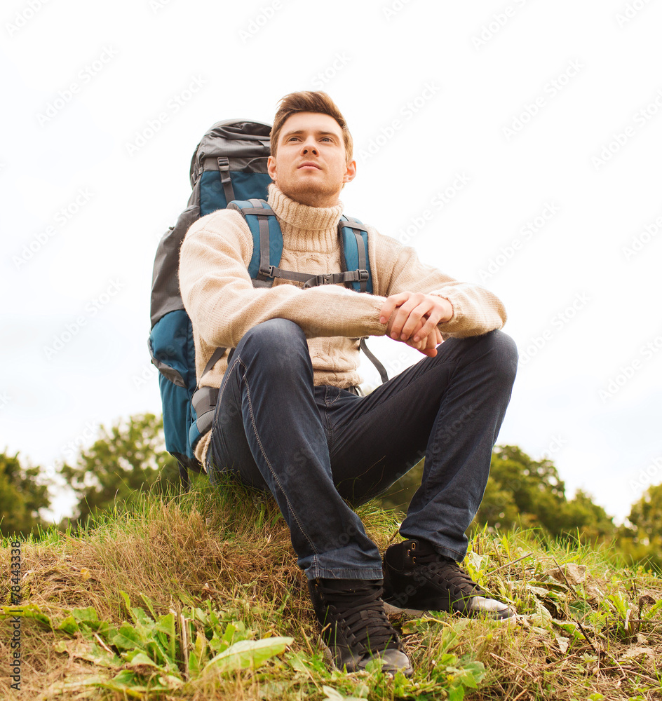 man with backpack hiking