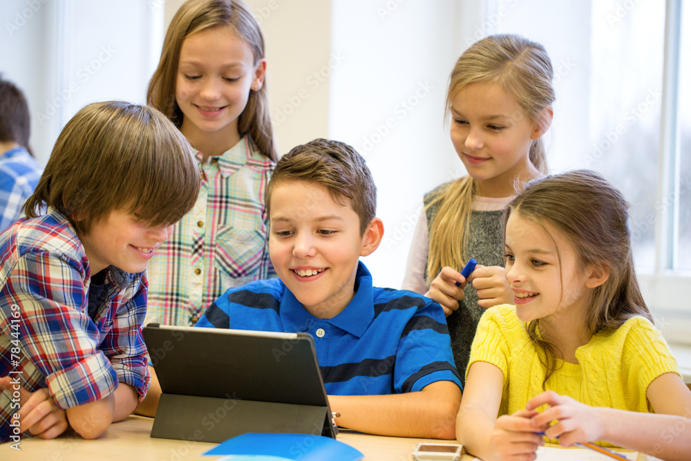 group of school kids with tablet pc in classroom group of school kids with tablet pc in classroom