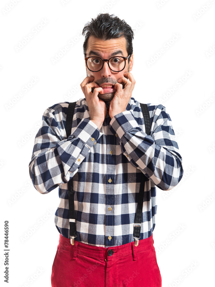 Frightened posh boy over white background