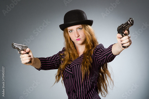 Woman gangster with gun in vintage concept © Elnur