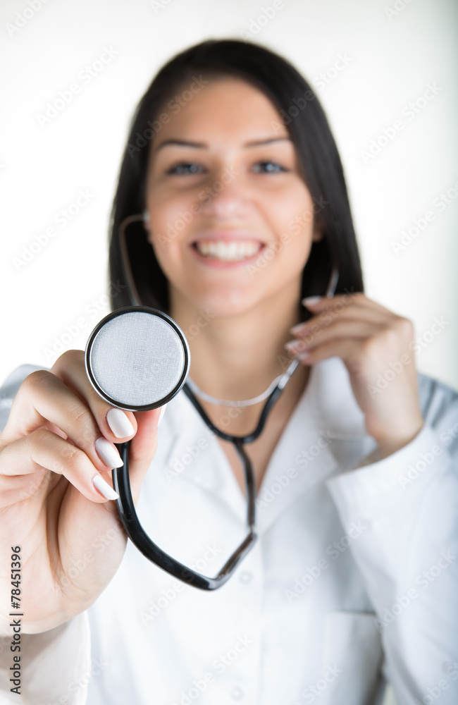Beautiful brunette smiling woman doctor with stethoscope Beautiful brunette smiling woman doctor with stethoscope