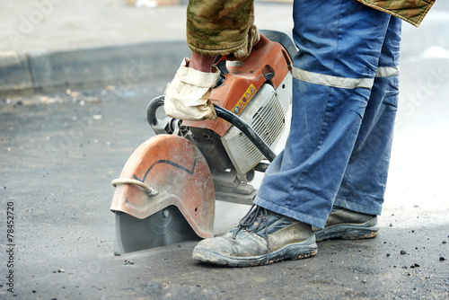 Obraz na plátne construction worker with cut-off machine