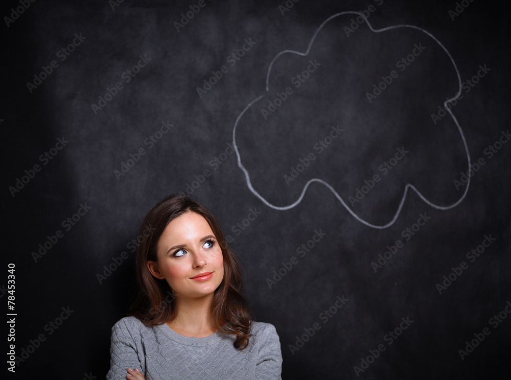 portrait of attractive girl thinking and pointing up to blank portrait of attractive girl thinking and pointing up to blank