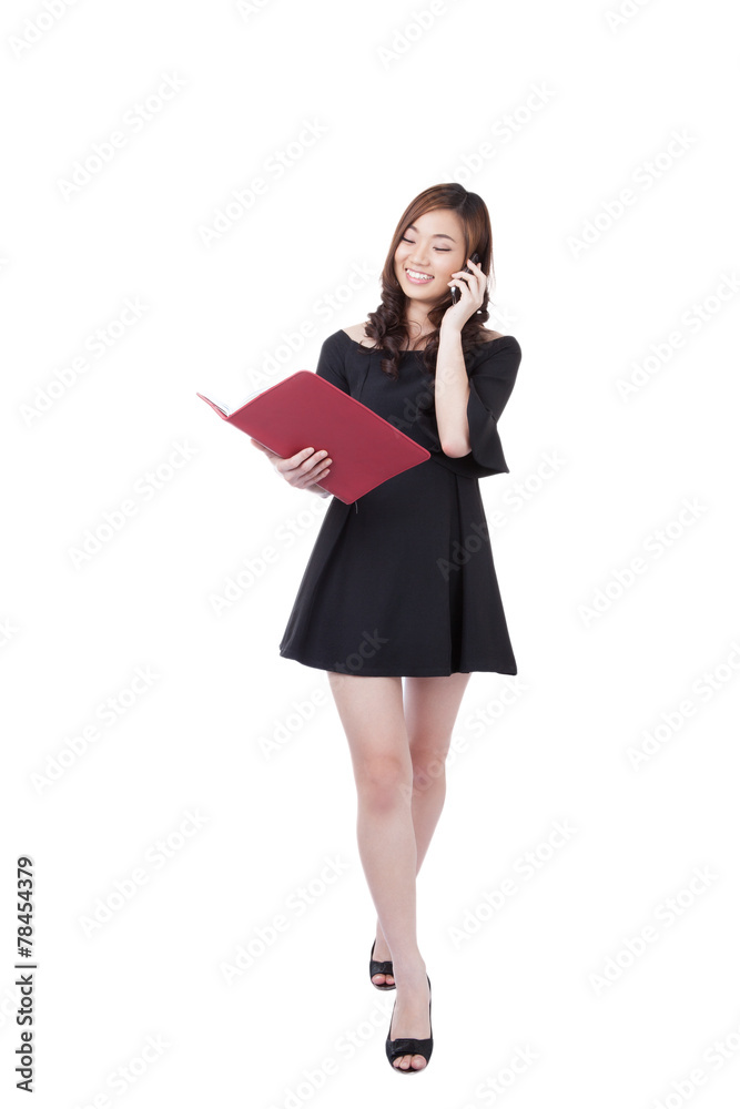 Businesswoman walking talking on mobile phone. Businesswoman walking talking on mobile phone.