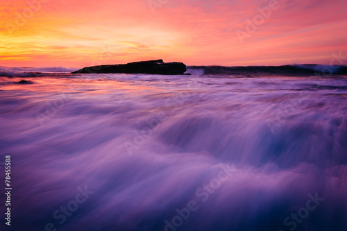 Waves and rocks in the Pacific Ocean at sunset  seen at Shell Be