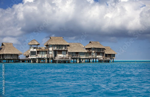 Typical Polynesian landscape -small houses on water.