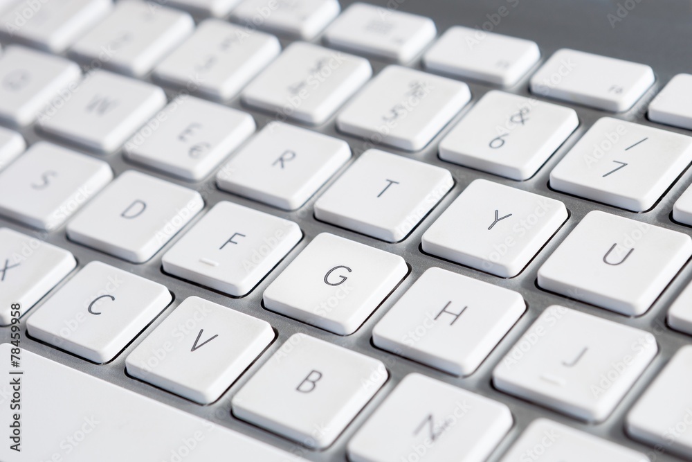 Close up of a computer keyboard with white keys Close up of a computer keyboard with white keys