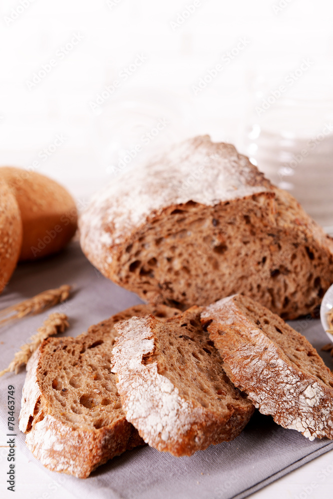 Tasty bread on table on light background