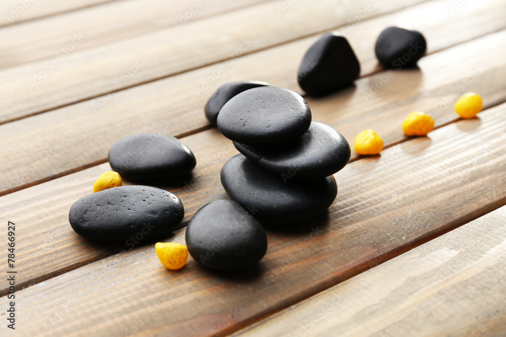 Spa stones drops on wooden background Spa stones drops on wooden background