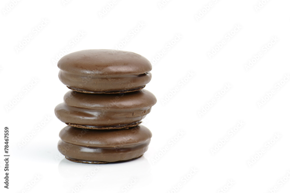 Stack of chocolate pieces on a white background