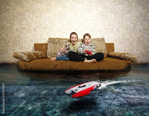 Young boy and girl with radio control. Playing with RC boat