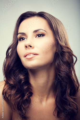 Studio portrait of beautiful young brunette woman