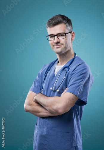 Confident young doctor posing