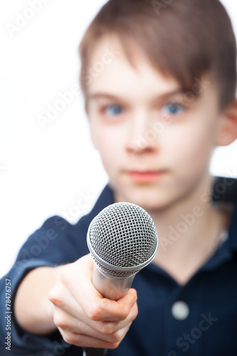 Boy holding microphone, focus on mic