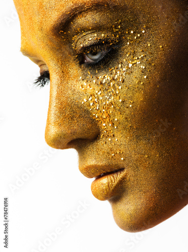 beautiful woman model with professional makeup, golden face