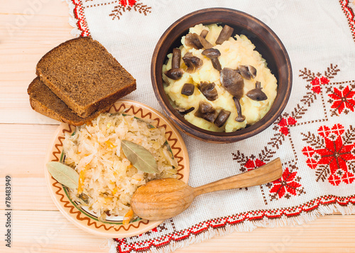 potatoes with mushrooms and sauerkraut on a wooden table, Lenten