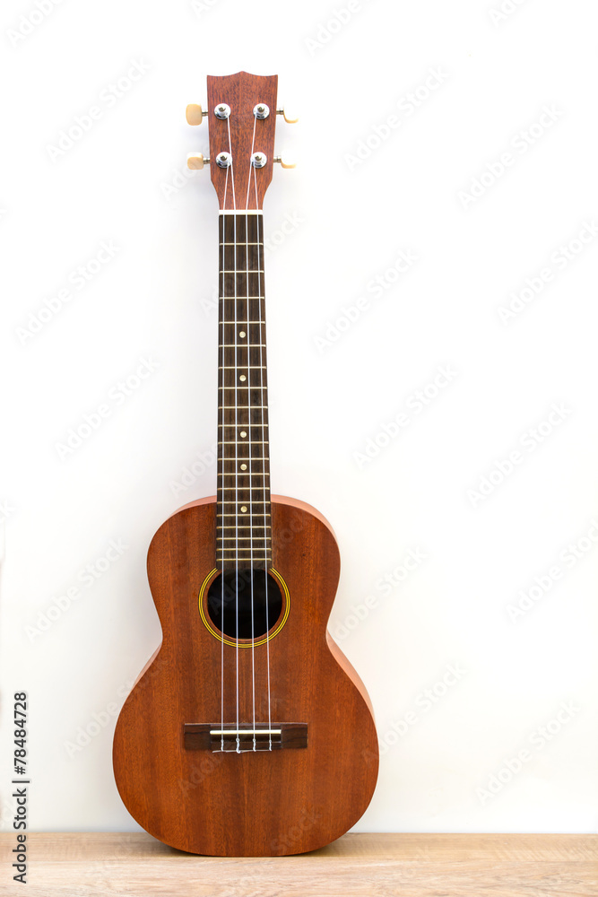 Ukulele on wooden table