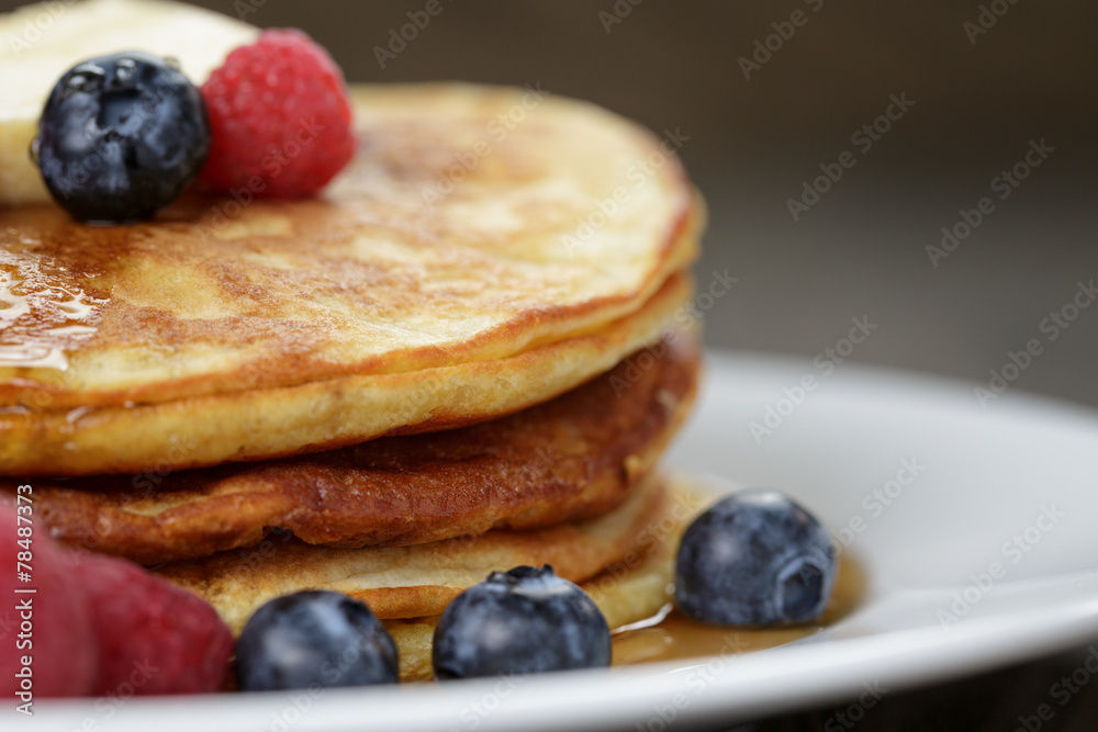 Classic pancakes with butter berrys and maple syrup Classic pancakes with butter berrys and maple syrup
