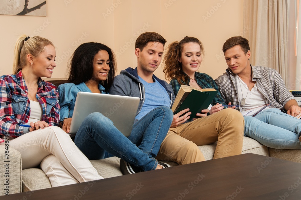 Group of students preparing for exams in apartment interior Group of students preparing for exams in apartment interior
