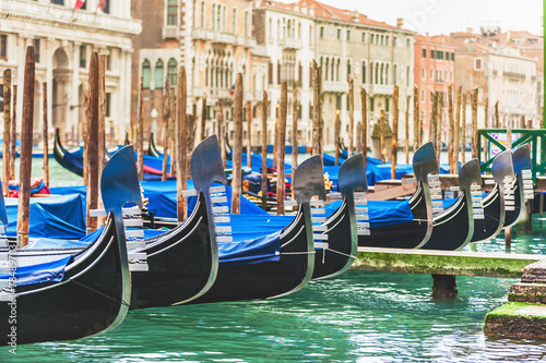 Gondolas in Venice has a background of buildings