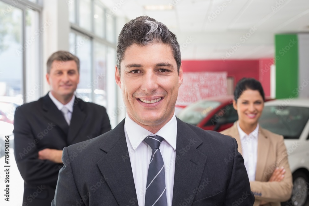 Group of smiling business team standing together Group of smiling business team standing together