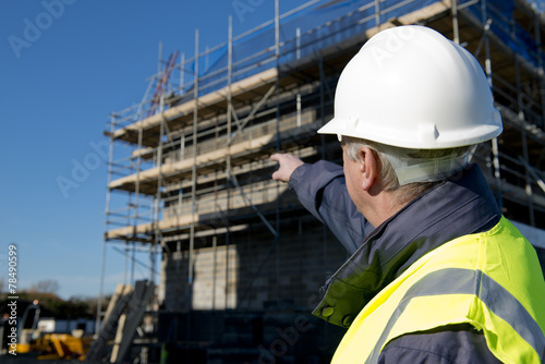 Civil Engineer Pointing At Building Site