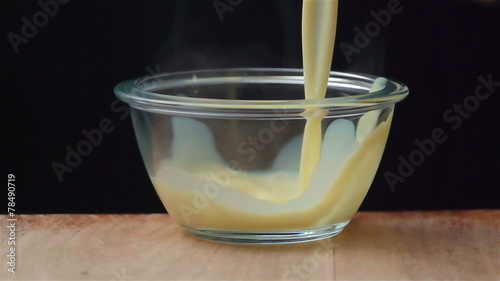 Slow motion of flan cooking. Find similar in our portfolio.