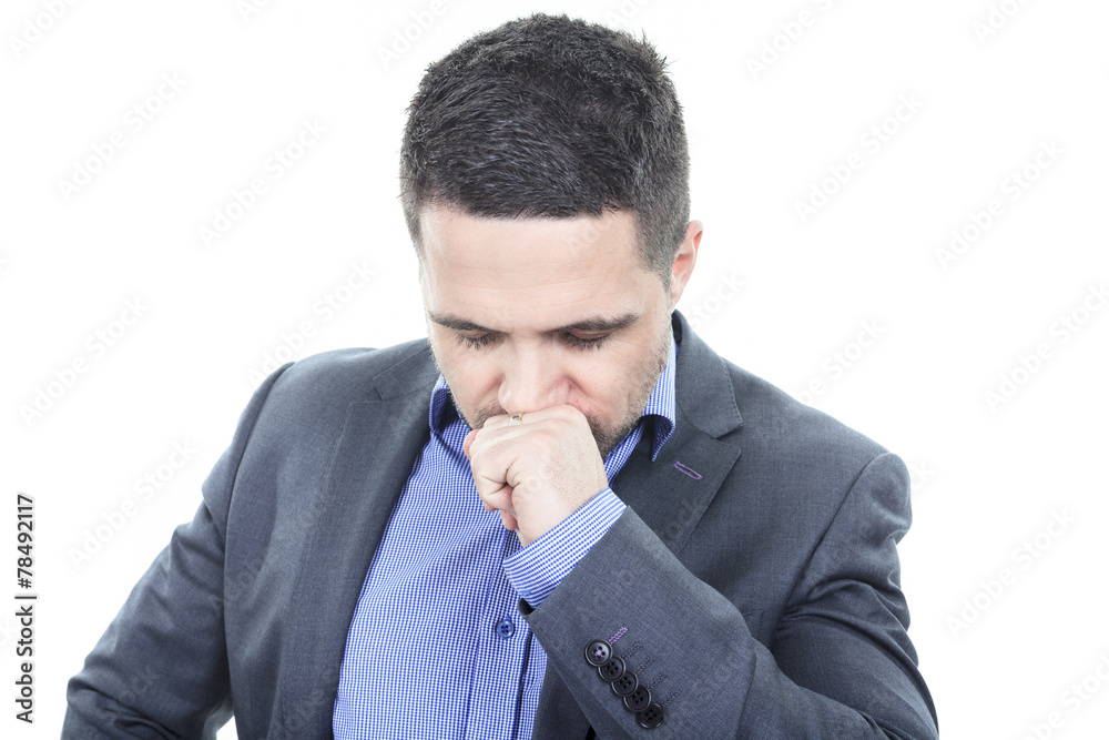 A beautiful business man standing against grey background A beautiful business man standing against grey background