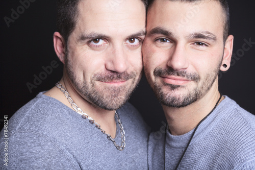 Gay couple on black background