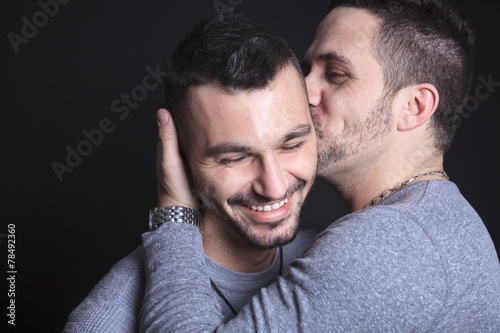 фотографія Gay couple on black background