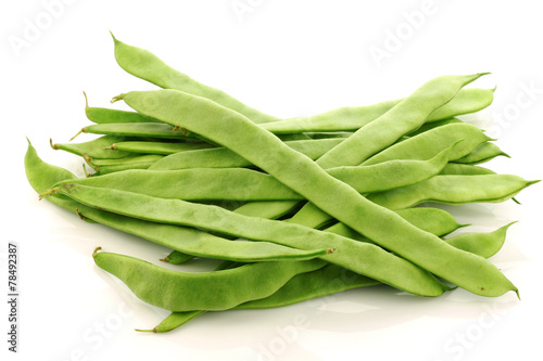 fresh string beans on a white background