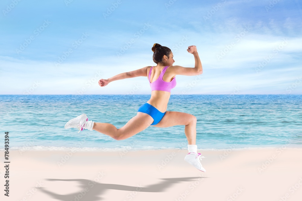 Composite image of fit brunette running and jumping Composite image of fit brunette running and jumping