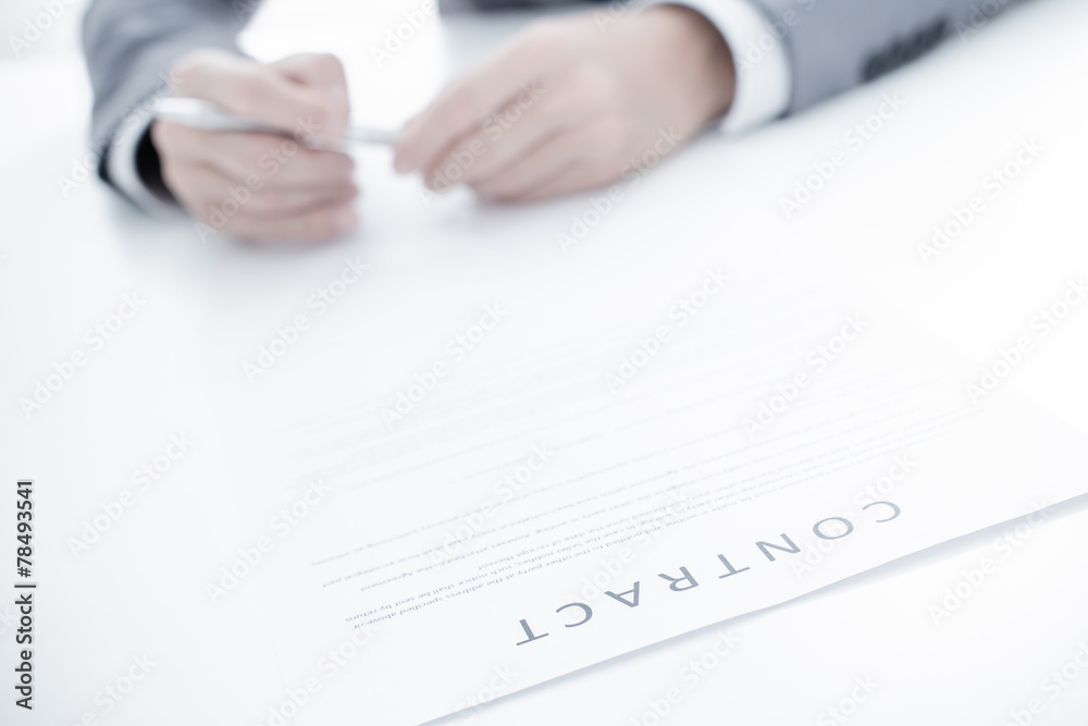 Business man signing a contract Business man signing a contract
