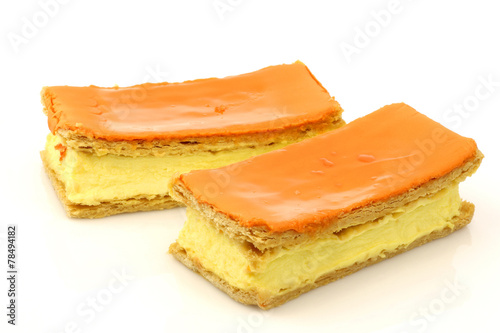 Traditional Dutch pastry called "tompouce" on a white background