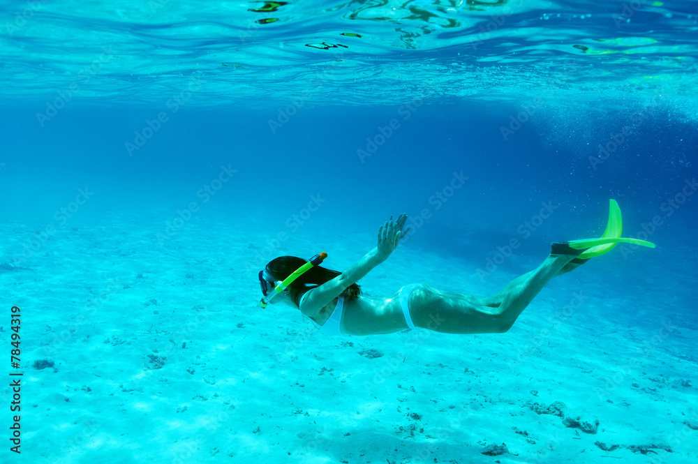 Woman with mask snorkeling