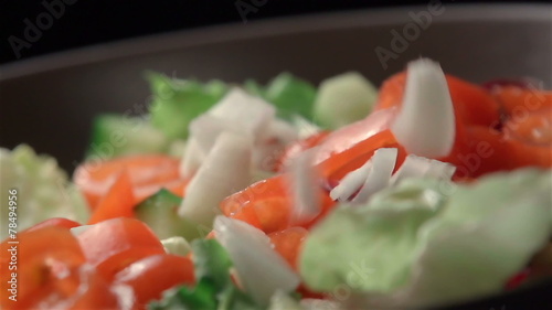 Slow motion of salad. Find similar in our portfolio.