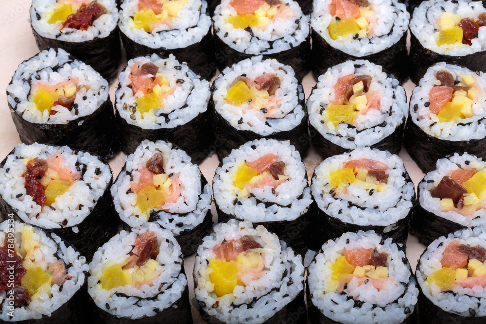 sushi fresh maki rolls isolated on wooden board sushi fresh maki rolls isolated on wooden board