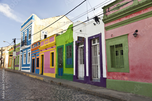 Cobbled street in historic city Olinda with colourful houses © Yols