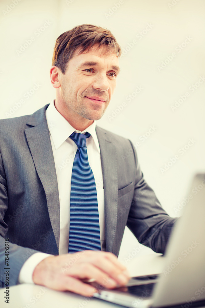 businessman with laptop in office businessman with laptop in office