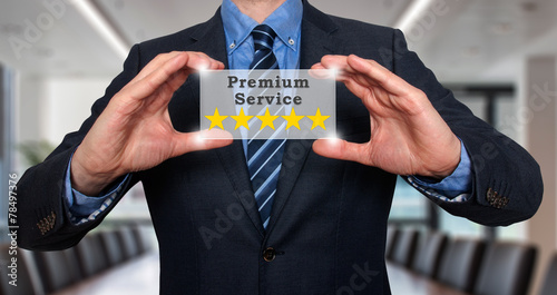 Businessman holds five stars premium service. Office