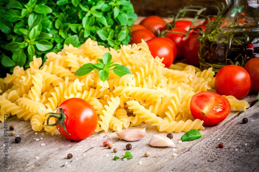 Ingredients for pasta: tomatoes, basil, fusilli, olive oil Ingredients for pasta: tomatoes, basil, fusilli, olive oil