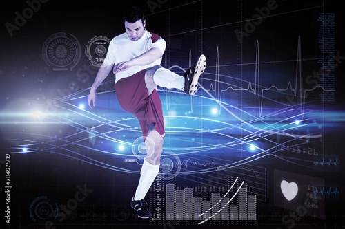 Composite image of football player in white kicking © WavebreakmediaMicro