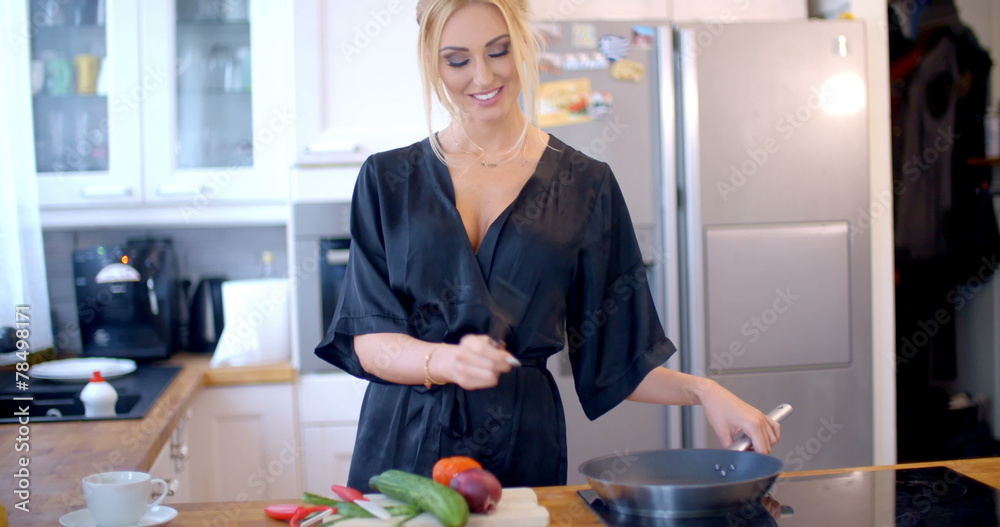 Sexy blond housewife cooking dinner Sexy blond housewife cooking dinner