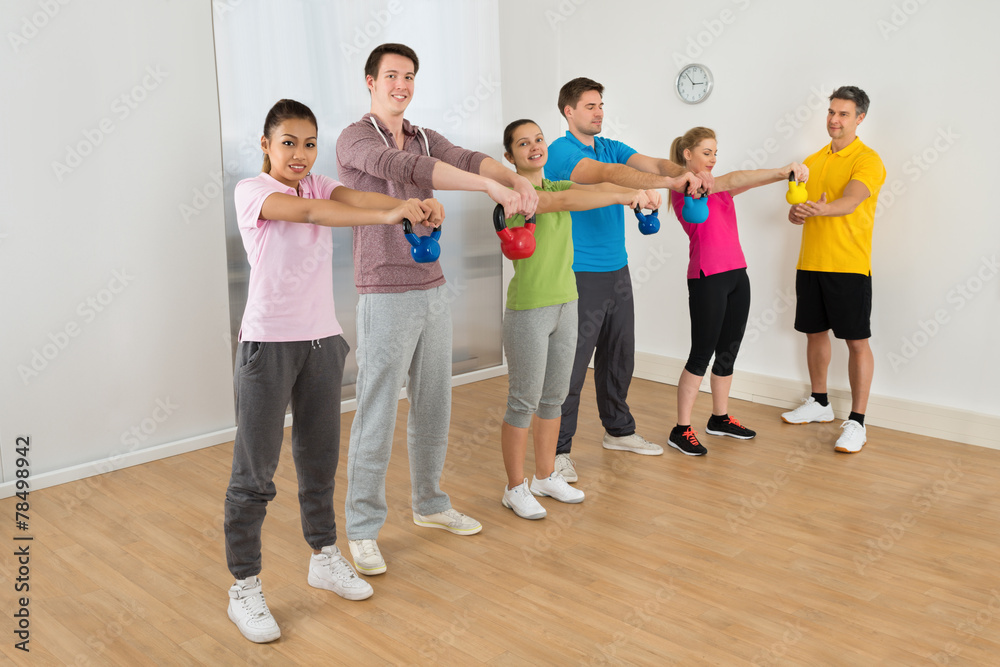 Fototapeta premium Fitness Instructor With People Exercising