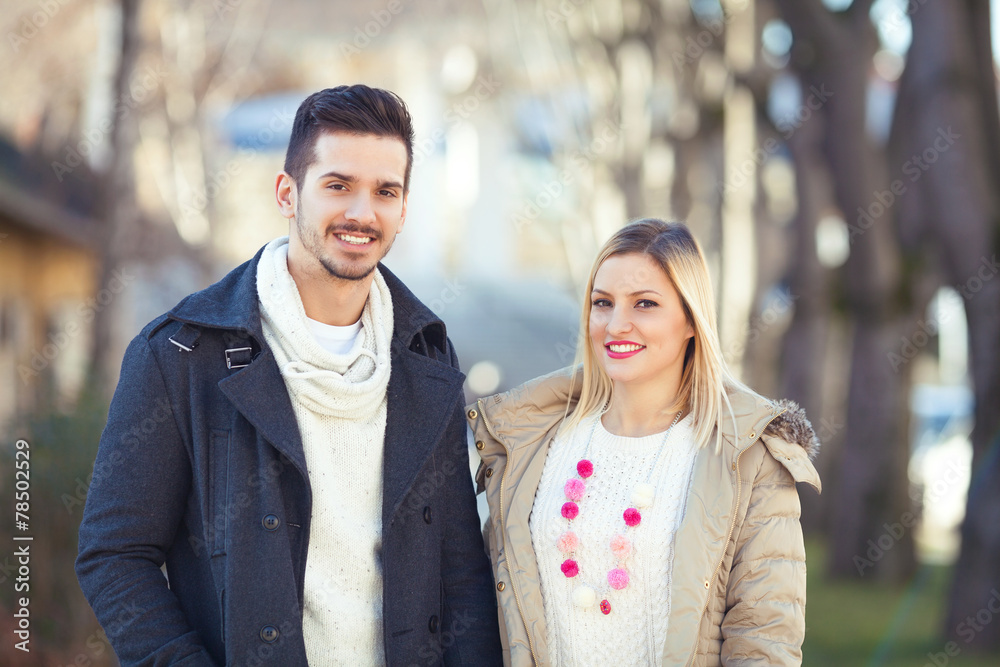 Outdoors portrait of happy young couple.