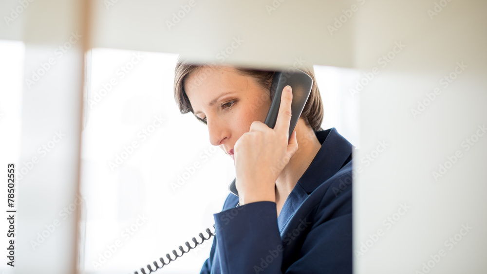 Businesswoman Talking to Someone Using Telephone Businesswoman Talking to Someone Using Telephone